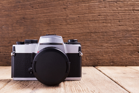 Vintage camera on wood background.の写真素材