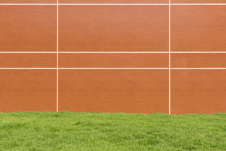 Orange walls and grass for background.の写真素材