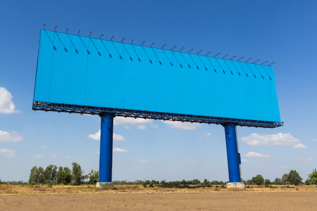 Billboard blank on blue sky background. For advertising your background.の写真素材