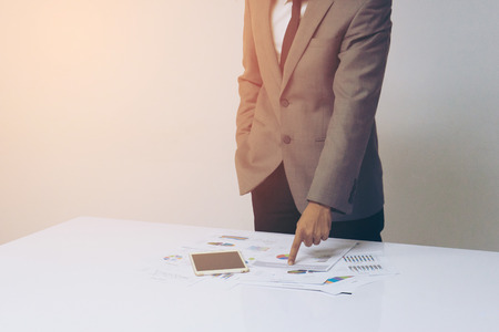 Business people hands working with a tablet on white table background. Copy space. Vintage toneの写真素材
