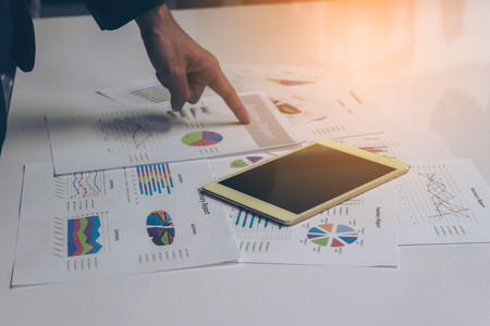 Business people hands working with a tablet on white table background. Copy space. Vintage toneの写真素材