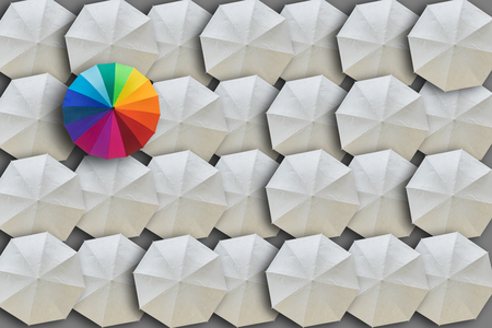 Concept of Leadership, Different and Distinction.Colorful umbrella and many white umbrellas aroundの写真素材