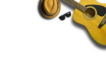 Acoustic guitar with hat and sunglasses on white background texture.Concept of music with Copy spaceの写真素材
