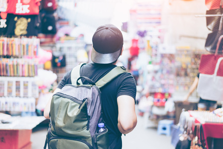 Young man traveler is visiting at Mongkok in Hong Kong.