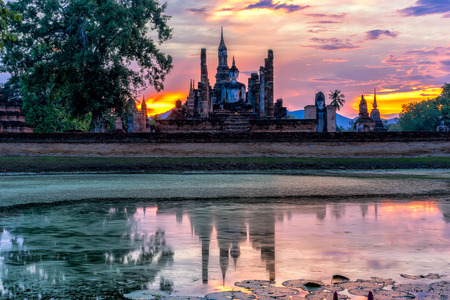 Sunset scence of Wat Mahathat temple in the Sukhothai Historical Park contains the ruins of old Sukhothai, Thailand.の写真素材