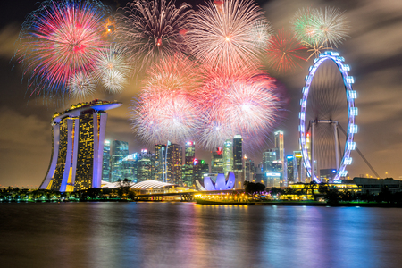 Landscape of the Singapore city landmark financial district at twilight sunset scene with Multicolor Firework Celebration. Singapore skyscraper downtown with Multicolor Firework Celebration.のeditorial素材
