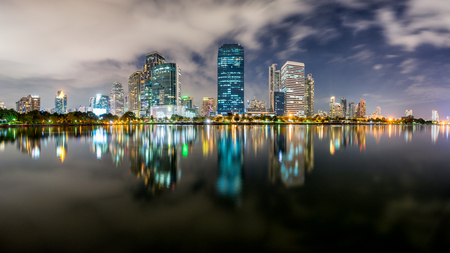 Dusk scence of Bangkok Panorama ,Aerial view of Bangkok modern office buildings and condominium in Bangkok city downtown with dusk sky and clouds at Bangkok , Thailand. And Reflection on Lake.の写真素材