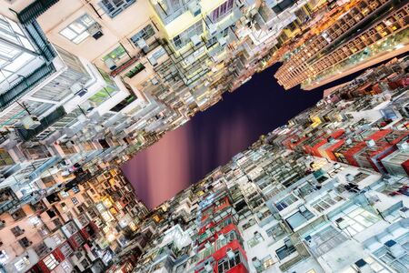 HongKong. Old tall and dense residential building in Hong Kong at dusk.の写真素材