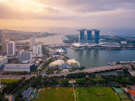 Aerial view of the Singapore landmark financial business district at sunrise scene with skyscraper and over clouds. Singapore downtownのeditorial素材