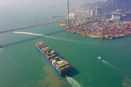 Aerial view of international port with Crane loading containers in import export business logistics...