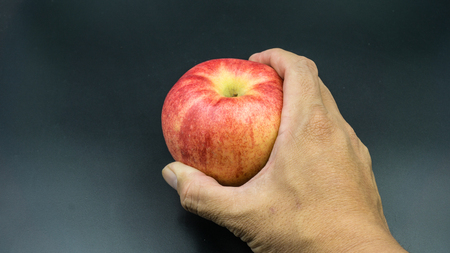 Apple in Hand grabの写真素材