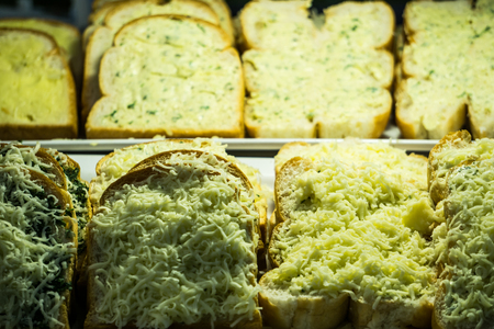 Slice of cheese garlic and spinach toast street food