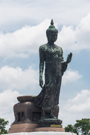 Large Bronze statue Walking Buddha Thailand South East Asia Travel Concept.の写真素材