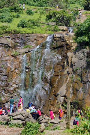 A waterfall is a river or other body of water's steep fall over a rocky ledge into a plunge pool belowの写真素材