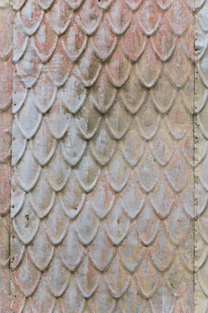 Vertical color close-up image of old wooden tile pattern facadeの写真素材