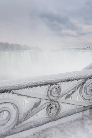 Close-up image of a frozen rail by the Niagra Falls water mist on a frozen winter morning, Ontario, Canadaの写真素材