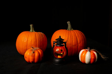 A Beautiful Arrangement of Festive Halloween Pumpkins and Lanterns Perfect for Autumn Celebrations and Gatheringsの写真素材