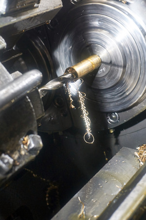 drill bit cuts hole for the bronze bushing on the lathe machine