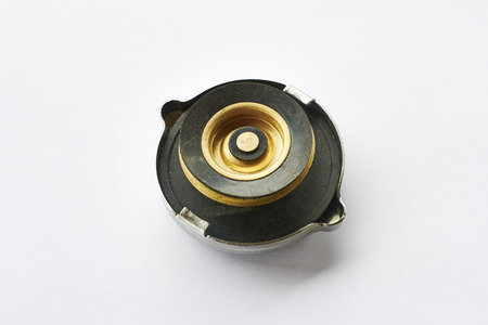 Car radiator cap with warning label isolated on white backgroundの写真素材