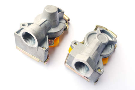 Pneumatic connecting heads with a valve on an isolated white background. Spare parts.