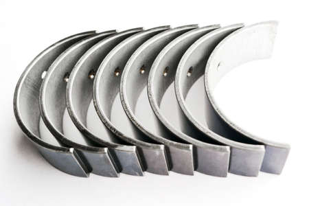 The crankshaft bearings of the car on an isolated white background. Spare parts.