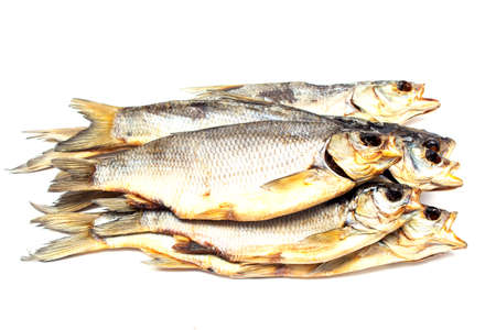 Isolated close up dried salted fish on a white background. Dried snacks for beer.の写真素材