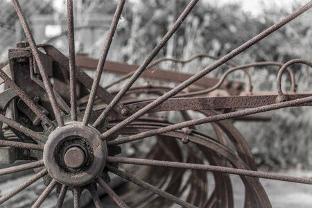 Close up of rusty old fashioned harrow farm machineryの写真素材
