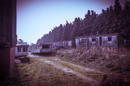 Rusty, old dilapidated holiday home trailer parkの写真素材