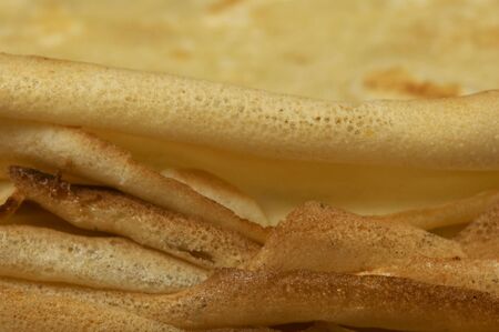 Close-up on the edge of a pancakes' pileの写真素材