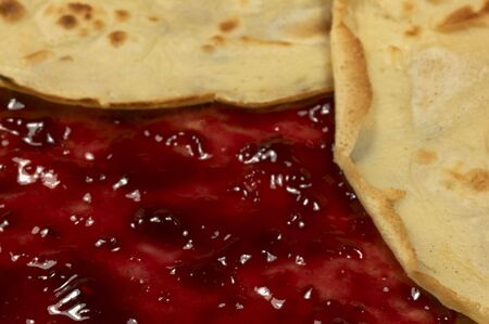 A close-up of pancake with raspberry's jam insideの写真素材