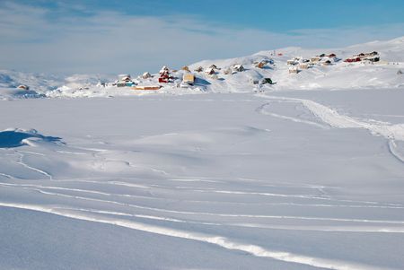 A small inuit village lost in a snowy landscapeの写真素材