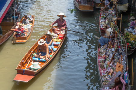 boat traffic jam during the rain at the floating market on the Canal in Damnoen Saduakのeditorial素材
