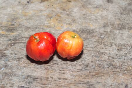 Barbados Cherry on wood backgroundの写真素材
