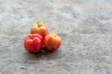 Barbados Cherry on wood backgroundの写真素材