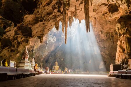 Phetchaburi, Thailand - April 26 2015: Tham khao luang cave temple (130 KM from Bangkok) is very beautiful temple inside of the cave. The sunshine penetrates from the top make inside even more beautiful.のeditorial素材