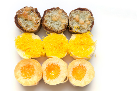 Small cakes on a black tray.