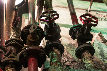 close-up of old gate valve on pipe