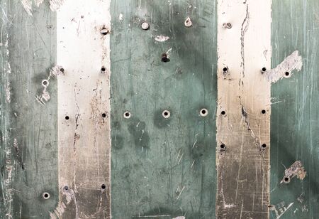 Abstract metal texture covered with scratches and old paintの写真素材