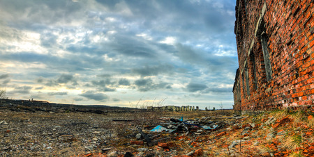 Cloudy sky over the broken buildingsの写真素材