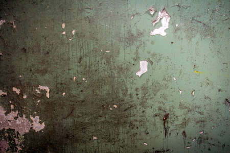 Concrete wall covered with old paintの写真素材