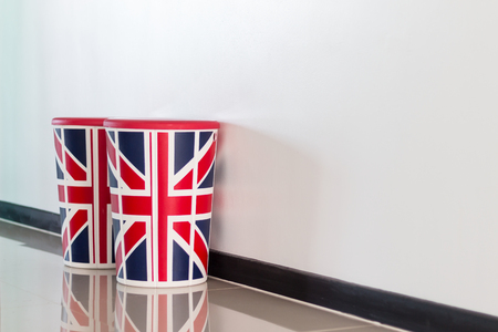 chair with the British flag on the background of a white wallの写真素材
