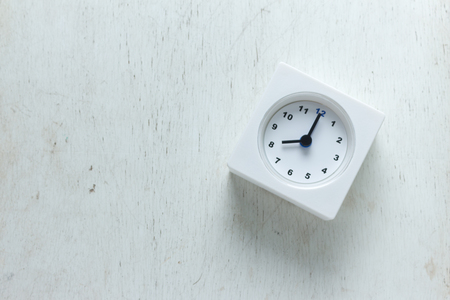 alarm clock wooden texture background. Top viewの写真素材