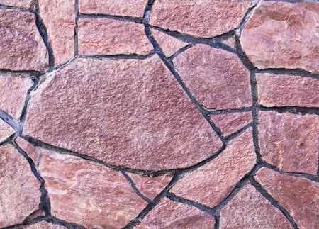 the texture of the stone facade of the buildingの写真素材