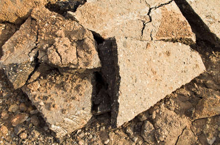 the pieces of the shattered concrete with clay and sandの写真素材