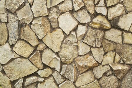 the texture of the stone finish of the buildingの写真素材