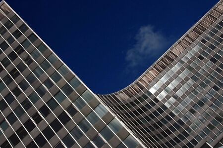 Modern skyscraper against the dark blue sky