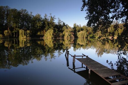 Jetty in a tranquil lakeの写真素材