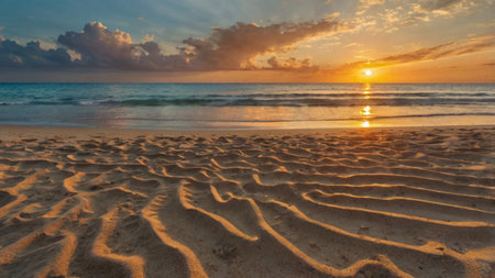 Beautiful sunset on the beach with sea wave and sand dunesの写真素材