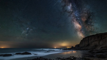 Milky Way over the sea at night. Long exposure photograph.の写真素材
