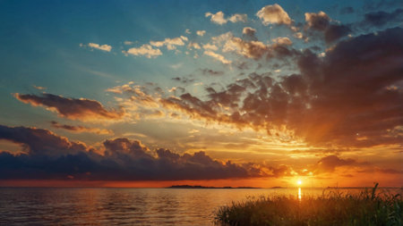 Beautiful sunset over the lake. Colorful sky with clouds.